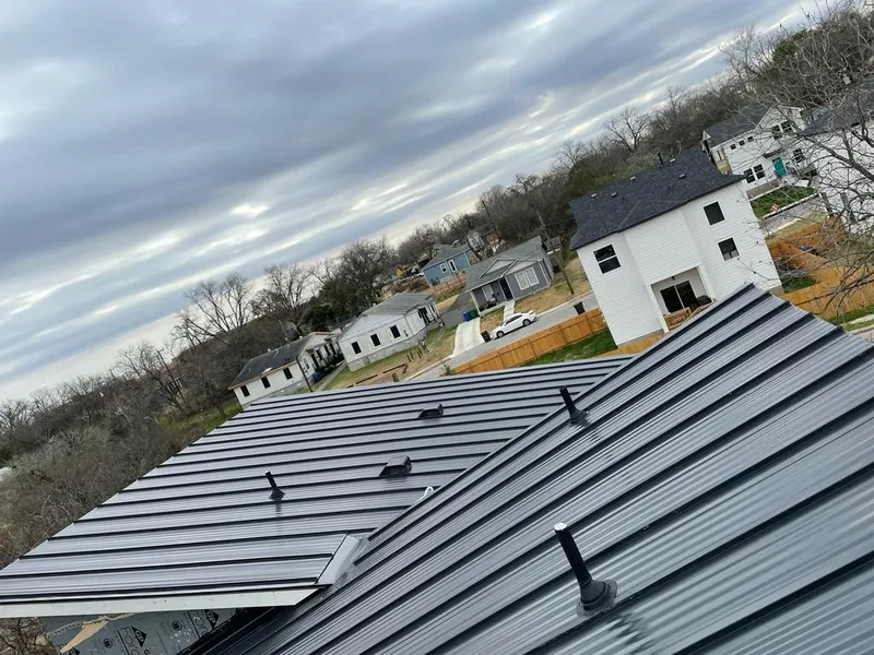 Standing seam metal roof panels with vents for Skylight Repair in Millcreek